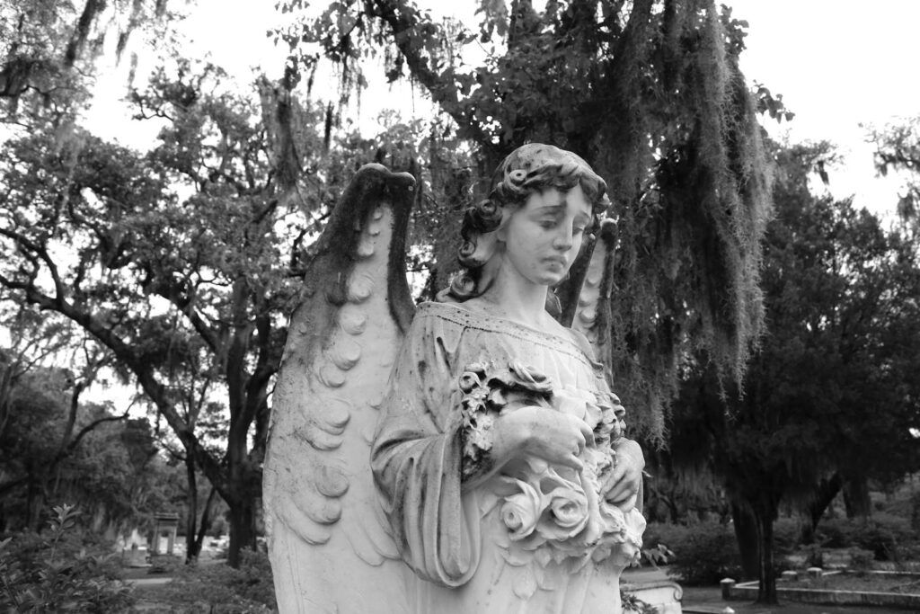 Serene angel sculpture in Savannah, Georgia's historic cemetery.