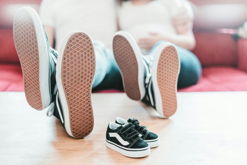 Child and Father dressed the same, both sitting with feet on table - Father’s Day