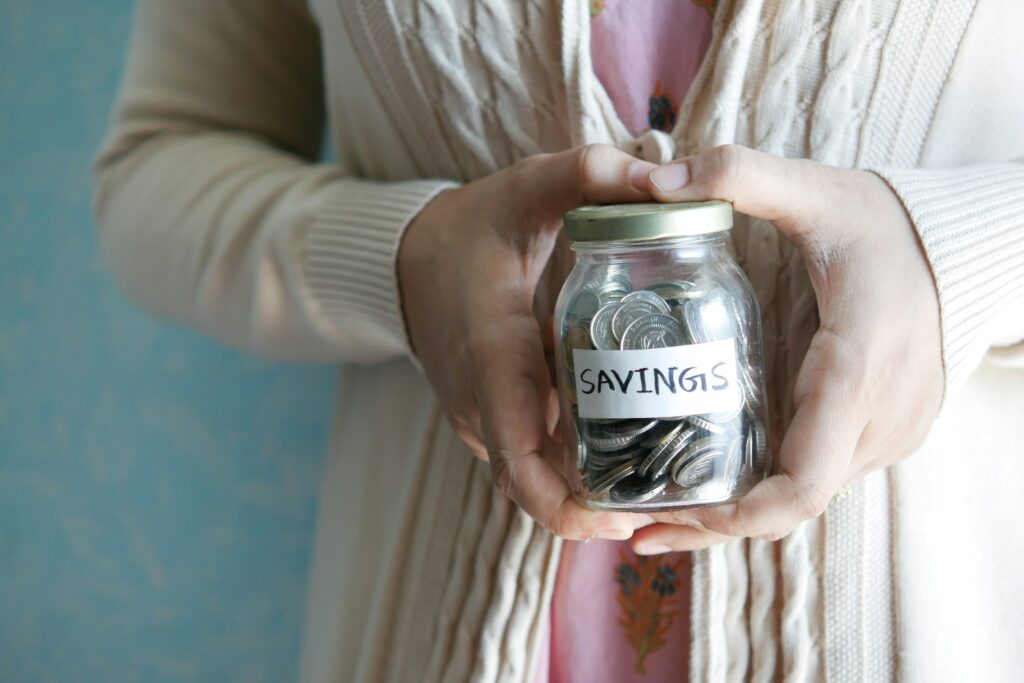 Jar full of savings change - debt management