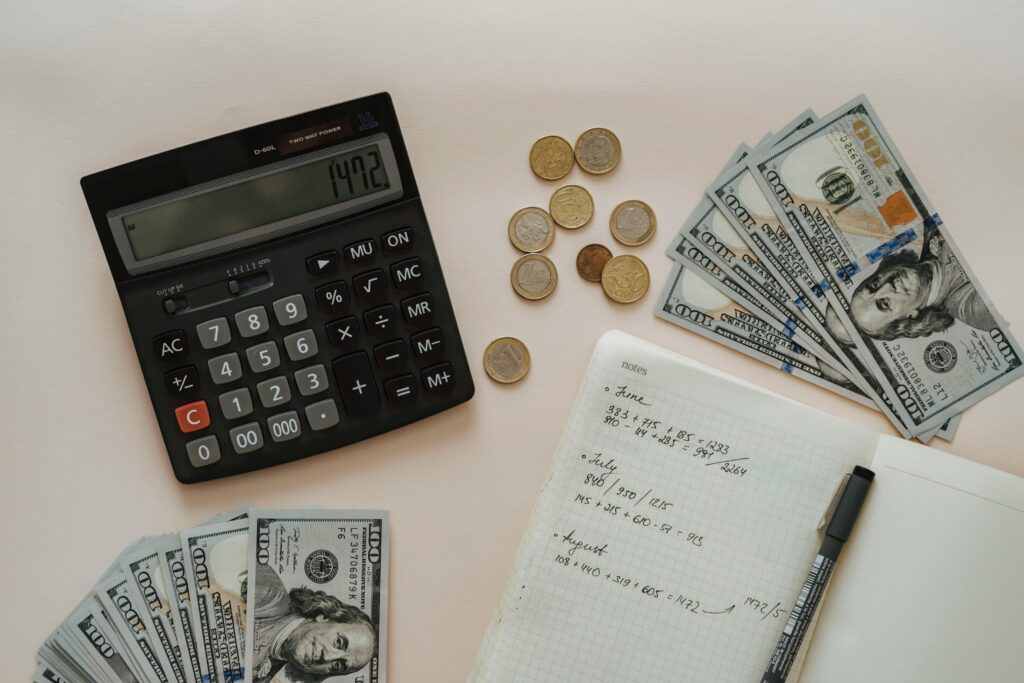 Calculator, cash, list of expenses - beginner’s budgeting