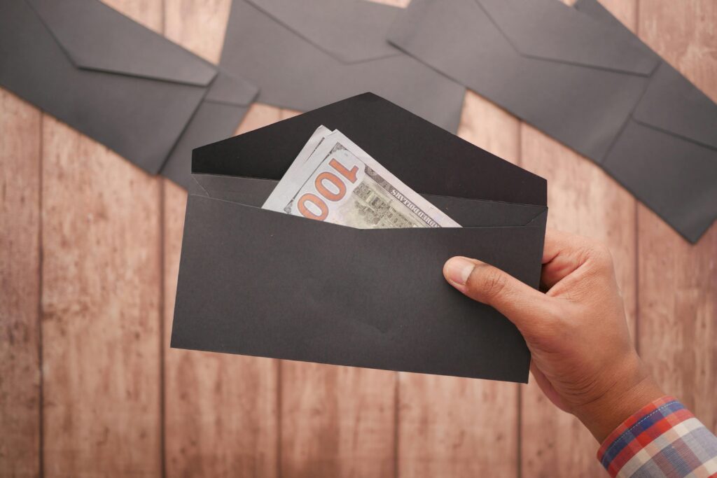 Black envelopes with cash - beginner’s budgeting 